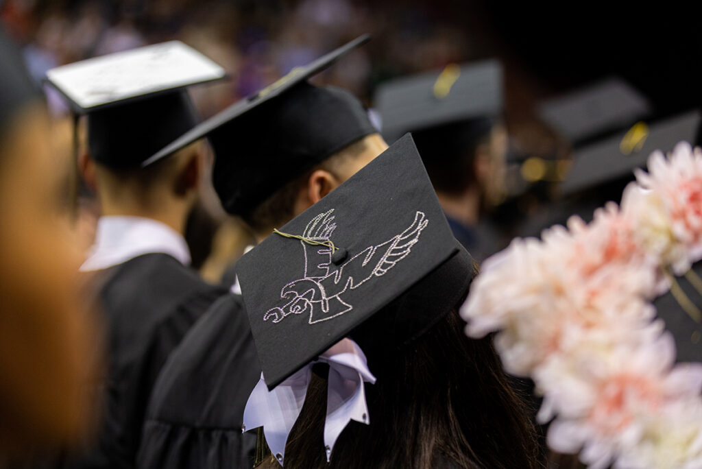 Photo of a graduation cap with an eagle on it.