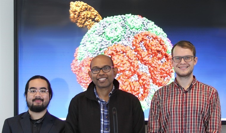 Three people smiling